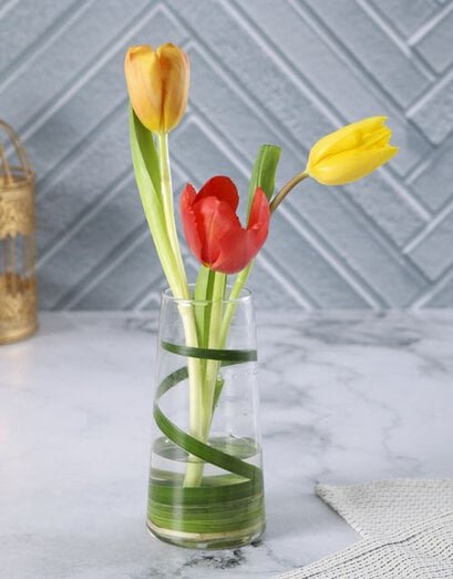 Radiant Tulip Trio In A Bud Vase