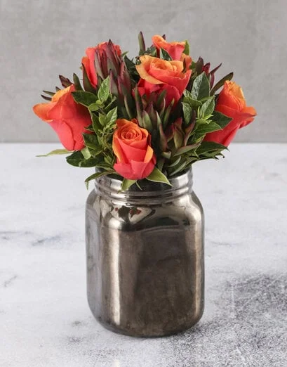 Cherry Brandy Roses In A Bronze Vase - Product image
