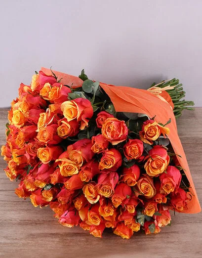 Cherry Brandy Roses In Orange Wrapping - Product image