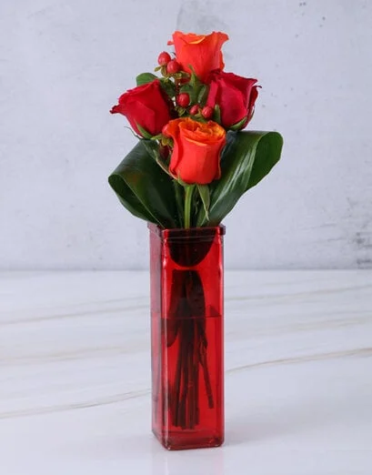 Cherry Brandy Roses In Red Vase - Product image