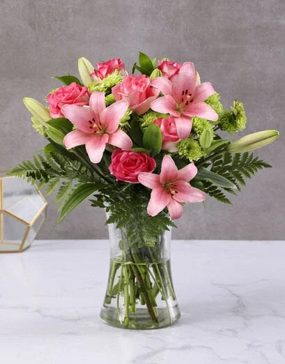 Lush Pink Lilies And Cerise Roses In A Vase - Product image