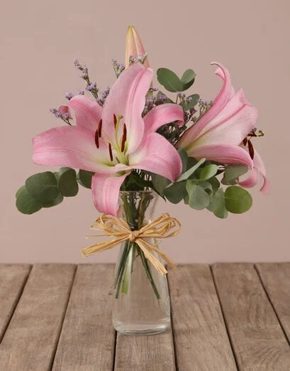 Stargazer Lilies in Hourglass Vase - Product image