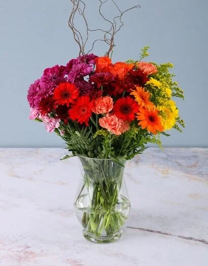 Sunset Flowers In Hurricane Vase - Product image